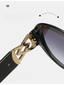 Detail of durable gold metal hinge with hollow design on black oval sunglasses