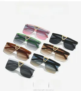 Detail of multi-color oversized square sunglasses with signature gold V-metal bridge design