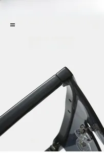 Detailed close-up of high-quality hinges on black thick-frame semi-rimless sunglasses