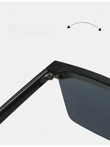 Detailed close-up of durable metal reinforced hinges on black semi-rimless sunglasses