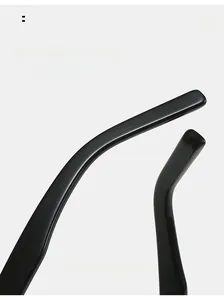 Detail of curved ergonomic temple tips on glossy black sunglasses for a comfortable fit