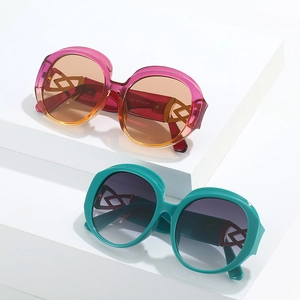 Retro oval sunglasses with gradient lenses and unique geometric hollowed temples