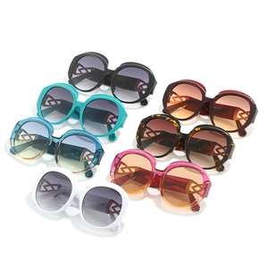 Retro oval sunglasses in various colors with decorative hollow-out geometric temples