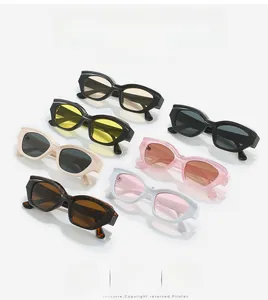 Detailed flat lay of vintage small oval sunglasses in multiple fashion colors