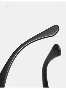 Detail view of glossy black curved temple tips designed for ergonomic comfort wear
