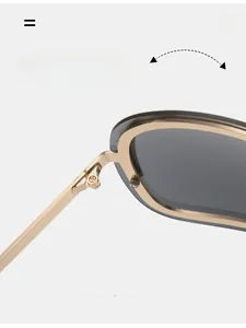 Close-up of durable metal texture hinges on retro Y2K sunglasses with champagne frames