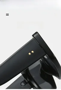 Close-up of black oversized square sunglasses showing gold rivet details and thick frame texture
