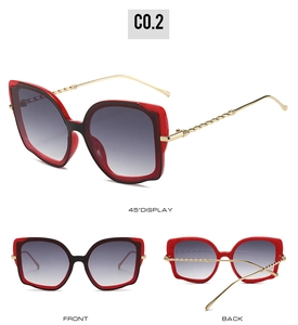 Detailansicht der Cat-Eye-Sonnenbrille mit gedrehten Goldbügeln und Verlaufsgläsern