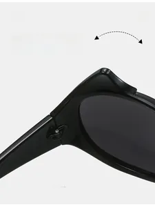 Detail view of the durable metal hinge construction on black Y2K devil sunglasses