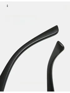 Detailed macro view of ergonomic curved black sunglass legs with a high-gloss finish