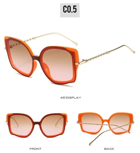 Cat-Eye-Sonnenbrille mit orangefarbenem Sechskantrahmen und goldenen Spiralkonstruktion