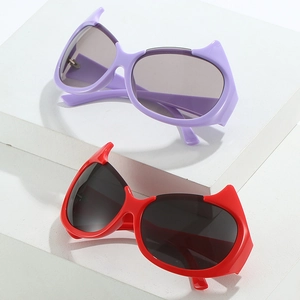 Y2K little devil sunglasses in purple and red on white geometric stands