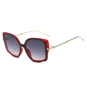 Cat-Eye-Schmetterlings-Sonnenbrille mit rot-schwarzem Rahmen und goldenen Metallbügeln