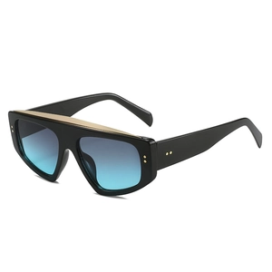 Oversized flat top sunglasses with black frame, gold trim, and gradient blue lenses