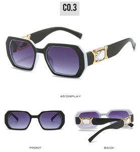 Detail of polygon sunglasses showing purple gradient lenses and crystal temple accents