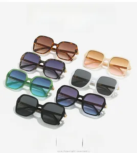 Flat lay of retro square sunglasses in various colors with stylish gradient lenses