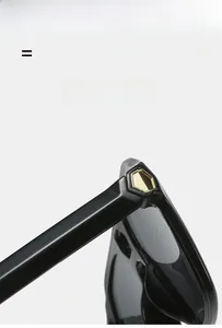 Detail of high-quality hinge on black sunglasses with gold hexagonal metal decoration
