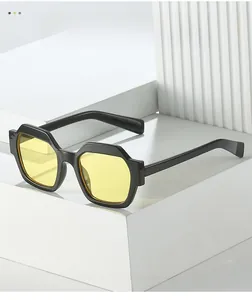 Macro shot of stylish black polygonal sunglasses frame with clear yellow tinted lenses