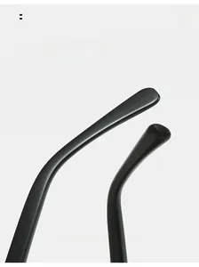 Detailed macro view of curved glossy black temples of vintage square sunglasses