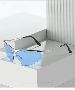 Detail of silver half-rim sunglasses with blue lenses and moon emblem on stone