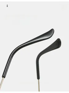 Detail view of ergonomic curved temple tips with sleek gold metal arms for cycling sunglasses