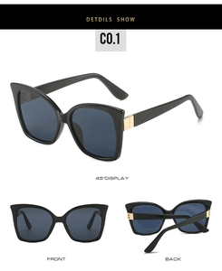 Detail view of cat eye sunglasses with gold hinge accents and UV protection lenses