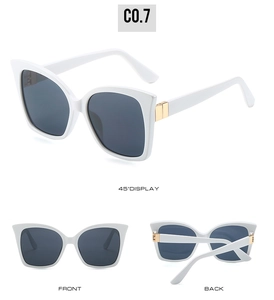 Three-view display of white cat-eye sunglasses with dark lenses and gold metal accents