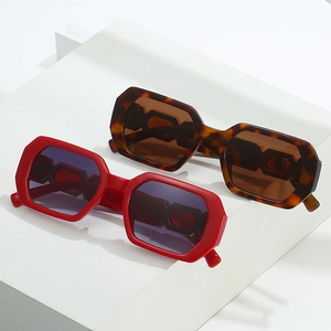 Modern polygonal sunglasses with chunky frames in red and tortoise shell colors