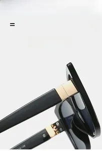 Detailed close-up of cat-eye sunglasses hinge with elegant gold metal decorative accents
