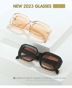 Detail of square frame sunglasses with rivet accents and blue light blocking lenses
