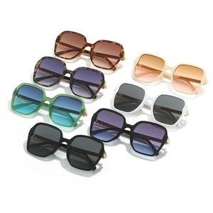 Collection of oversized square sunglasses in assorted vintage colors with gold accents