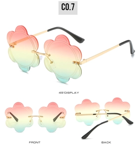 Three-way view of rimless flower-shaped sunglasses with gradient lenses and gold frames