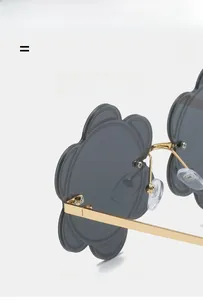Detailed macro view of lightweight golden metal frame and elastic hinge on floral sunglasses