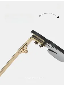 Macro view of durable golden metal texture hinges on rimless fashion sunglasses