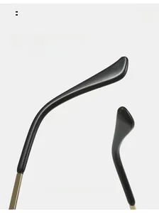 Close-up of curved metal glasses temples with ergonomic black resin ends for comfort