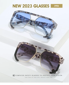 Detail view of oversized punk sunglasses with tortoiseshell frames and gradient lenses