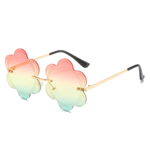 Rimless flower shaped sunglasses with rainbow gradient lenses and slim gold metal frame