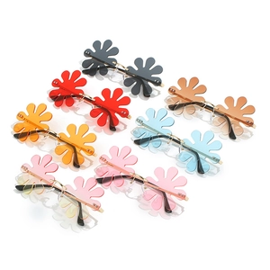 Frameless flower shaped sunglasses set in multiple colors with gold metal temples