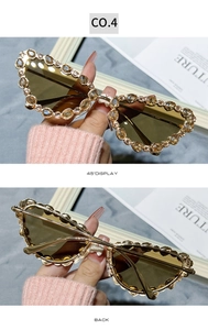Détails des lunettes de soleil œil de chat serties de strass champagne et verres bruns