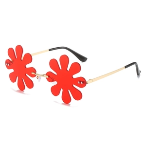 Frameless red flower-shaped sunglasses with stylish gold metal temples and clear red lenses
