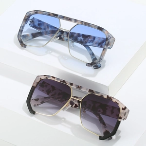 Modern punk oversized sunglasses with marble frames and gradient lenses on white display
