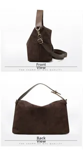 Detail view of large dark brown suede tote bag featuring adjustable shoulder strap and hardware