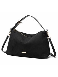 Macro shot of black suede shoulder bag featuring golden metallic hardware and matte texture
