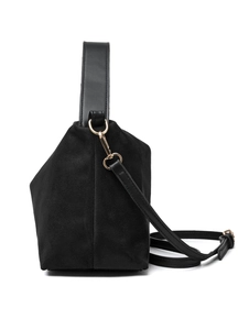 Detail of black faux suede tote bag featuring golden hardware and detachable shoulder strap
