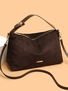 Brown suede underarm tote bag with gold hardware and removable shoulder strap