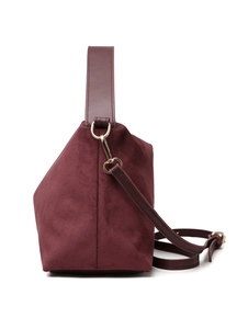 Detail view of burgundy suede tote bag showing geometric structure and leather handles