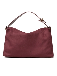 Detail of burgundy suede tote showing fine texture and golden metal hardware lock