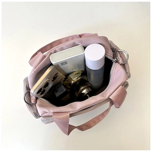 Top view of pink multi-pocket tote bag showing spacious interior with daily essentials