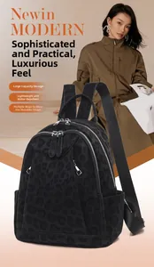 Close-up of leopard print backpack with water-resistant matte fabric and durable zippers