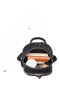 Detailed interior view of a leopard print backpack showing large storage capacity